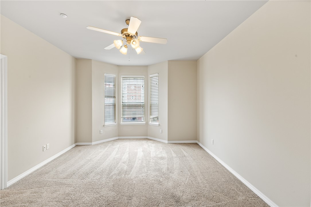 1198 Jones-Butler Road, Unit 1003 College Station, TX 77840 - Photo 15 of 42 wooden floor in an empty room with a window