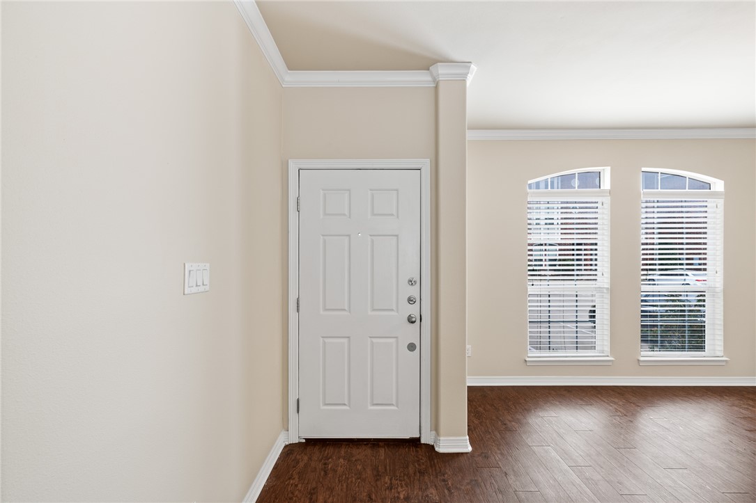 1198 Jones-Butler Road, Unit 1003 College Station, TX 77840 - Photo 2 of 42 a view of wooden floor and windows in a room