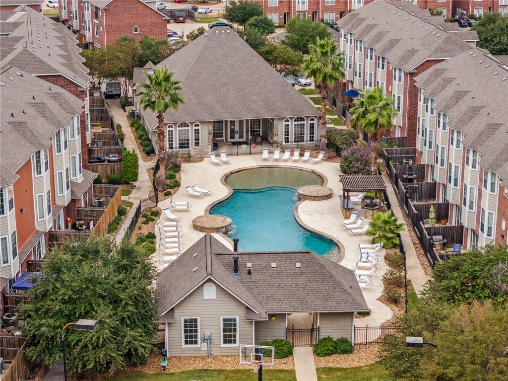 1198 Jones-Butler Road, Unit 1003 College Station, TX 77840 - Photo 30 of 42 an aerial view of a house with swimming pool and glass windows
