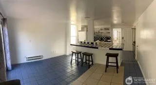 a view of dining room with furniture and wooden floor