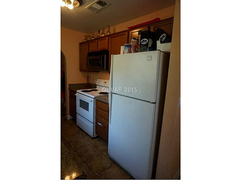 1846 North Decatur Boulevard, Unit 204 Las Vegas, NV 89108 - Photo 12 of 20 Kitchen. Kitchen fridge and stove.