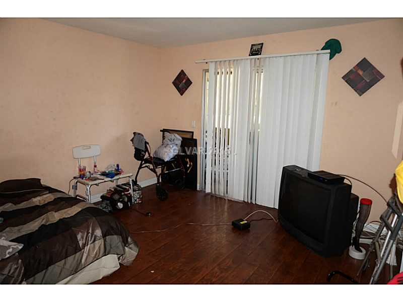 1846 North Decatur Boulevard, Unit 204 Las Vegas, NV 89108 - Photo 13 of 20 Master Bedroom. Master bedroom balcony entrance.
