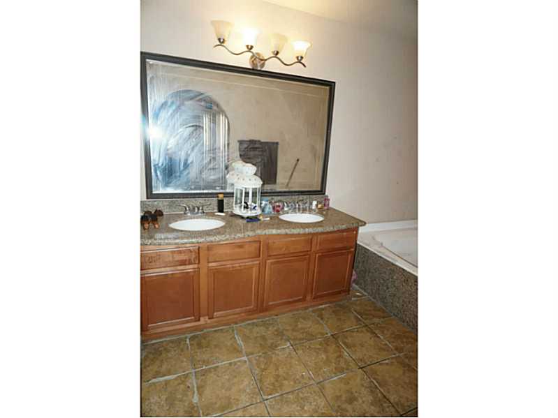1846 North Decatur Boulevard, Unit 204 Las Vegas, NV 89108 - Photo 14 of 20 Master Bath/Spa. Master bathroom dual sink, granite counters, upgraded light fixture and framed mirror. Separate tub and shower.