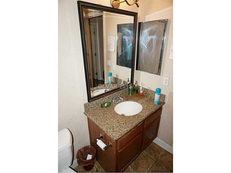 1846 North Decatur Boulevard, Unit 204 Las Vegas, NV 89108 - Photo 16 of 20 Guest Bathroom. Second bathroom upgraded vanity with custom mirror and granite counter.