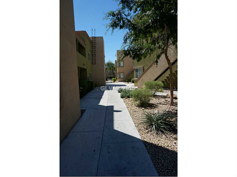 1846 North Decatur Boulevard, Unit 204 Las Vegas, NV 89108 - Photo 3 of 20 Facade/Exterior Front. HOA maintained pathways and landscaping.