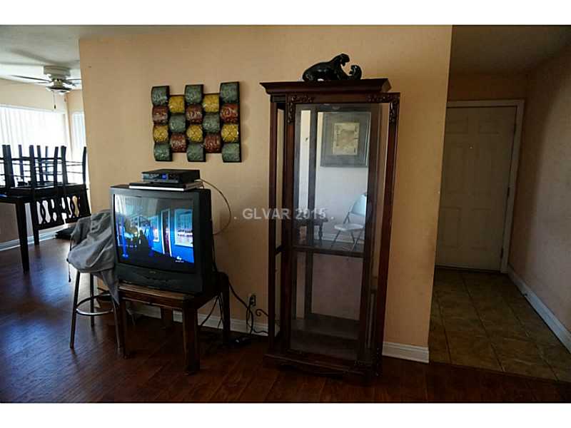 1846 North Decatur Boulevard, Unit 204 Las Vegas, NV 89108 - Photo 9 of 20 Living Room. Living room wall behind kitchen.