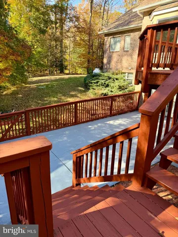 a kitchen with kitchen island white cabinets and refrigerator