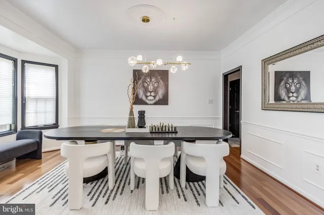 a view of a dining room with furniture and window