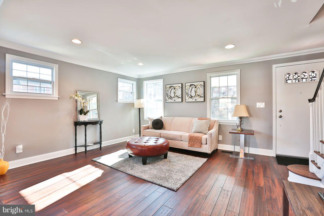 5136 Stafford Road Baltimore, MD 21229 - Photo 10 of 30 a living room with furniture and a wooden floor