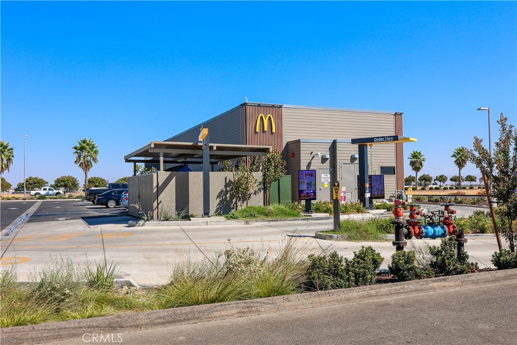 0 East Mission Avenue Merced, CA 95341 - Photo 16 of 24 a front view of a house with a yard