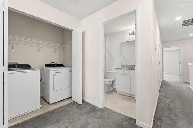 a view of a storage & utility room with closet