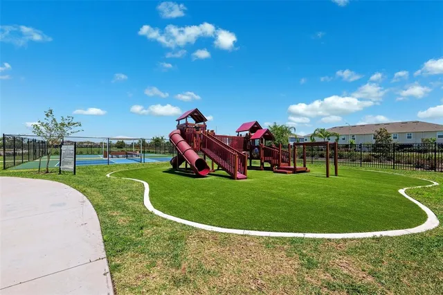 a view of a golf course with a swimming pool