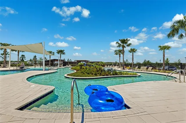 a view of a backyard with sitting area