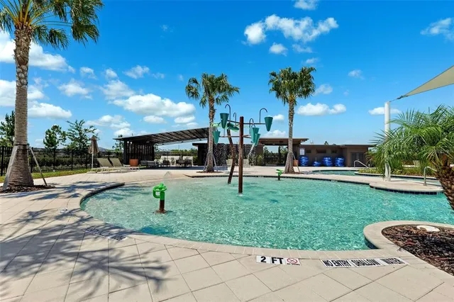 a view of a park with swings and slides