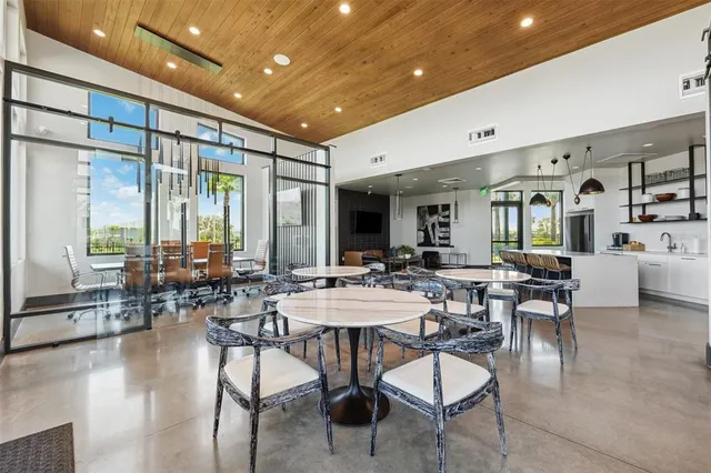 a view of a dining room with furniture and window