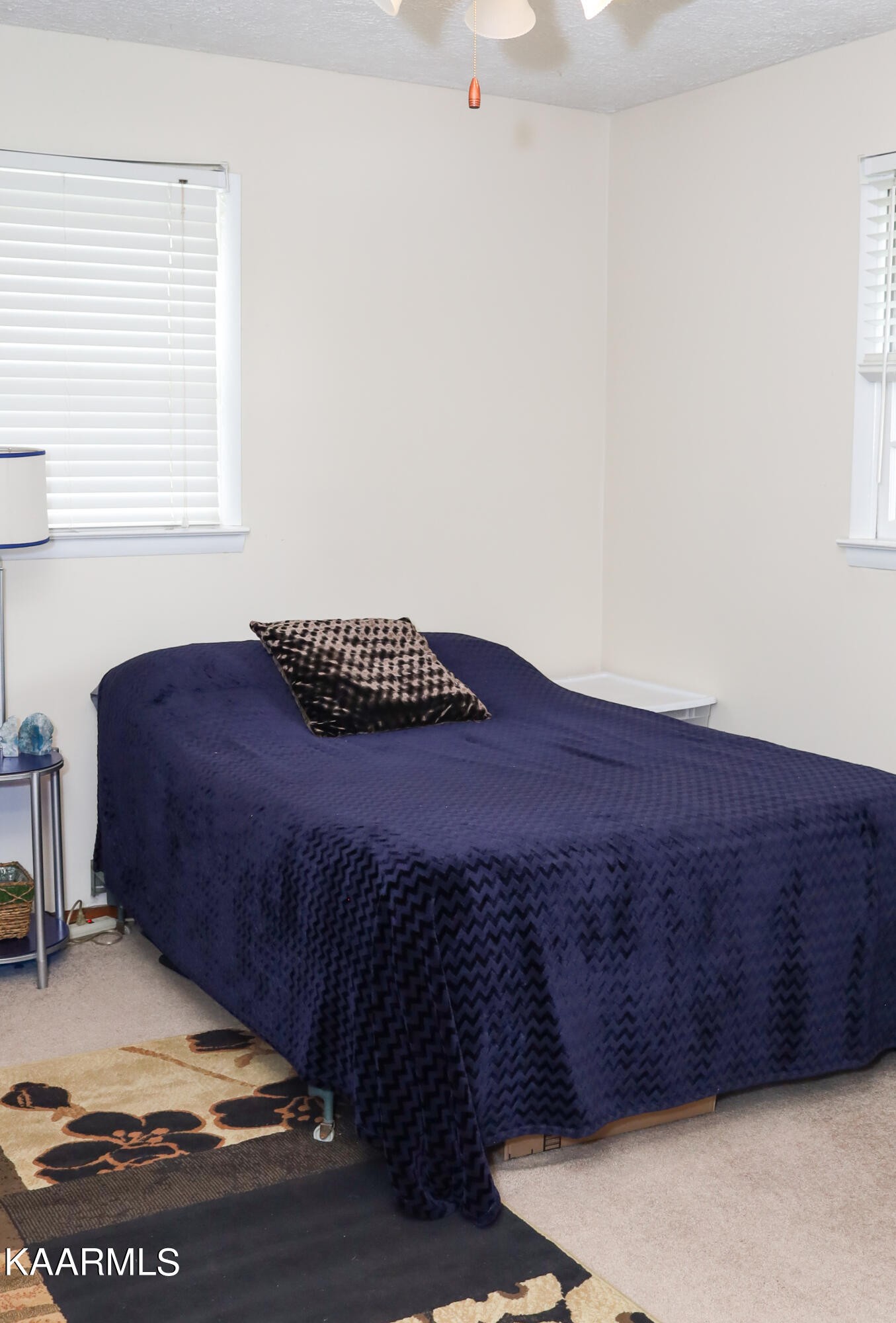 4105 Sullivan Road Knoxville, TN 37921 - Photo 13 of 45 a bed sitting in a bedroom next to a window