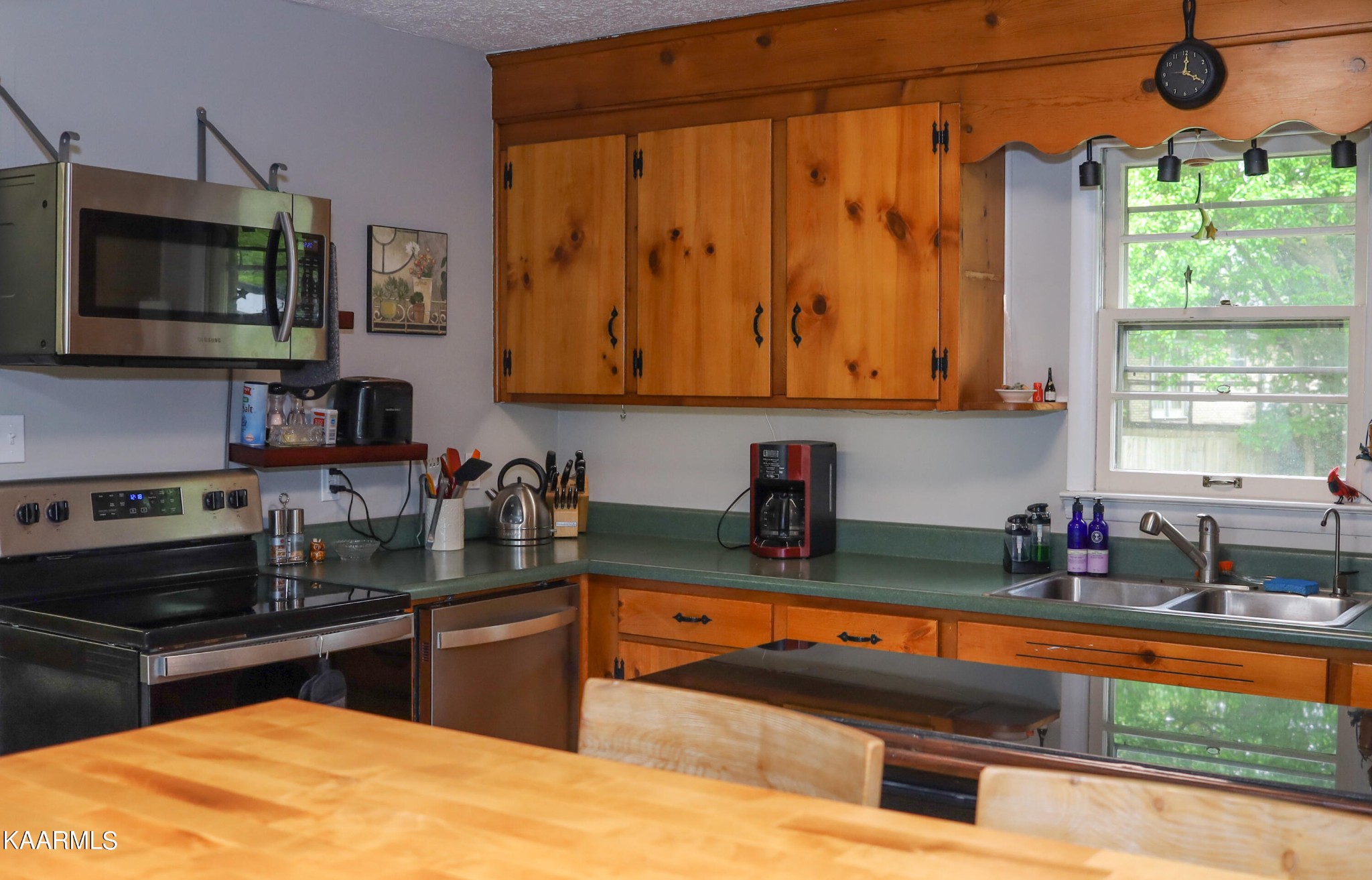 4105 Sullivan Road Knoxville, TN 37921 - Photo 28 of 45 a kitchen with stainless steel appliances granite countertop a sink a stove and a microwave