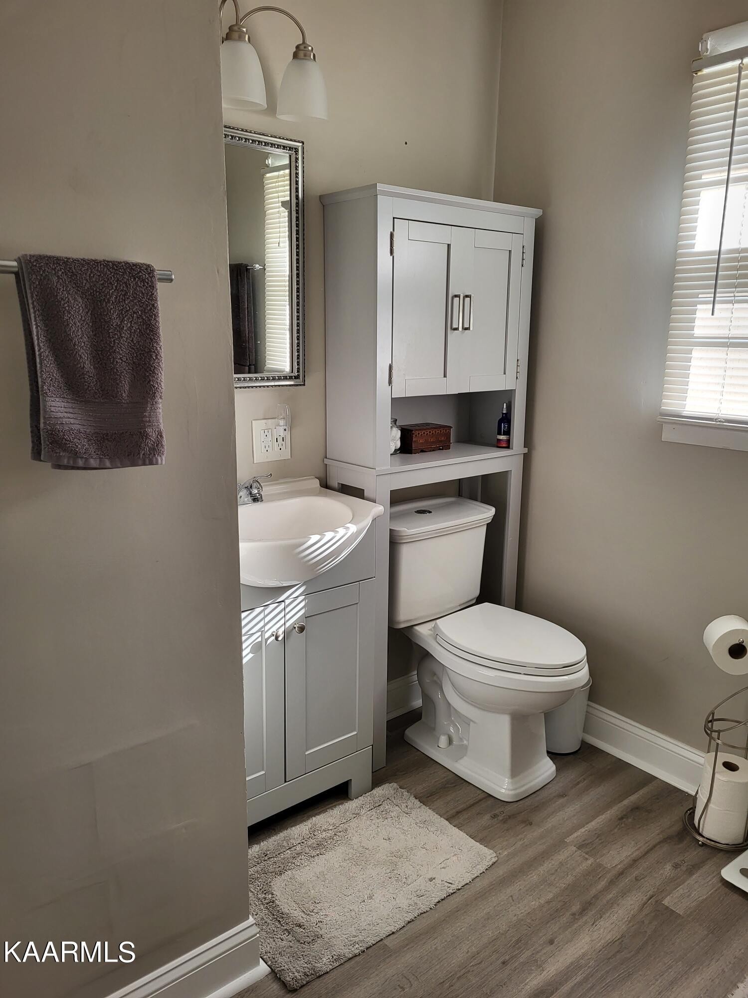 4105 Sullivan Road Knoxville, TN 37921 - Photo 40 of 45 a bathroom with a toilet a sink and mirror