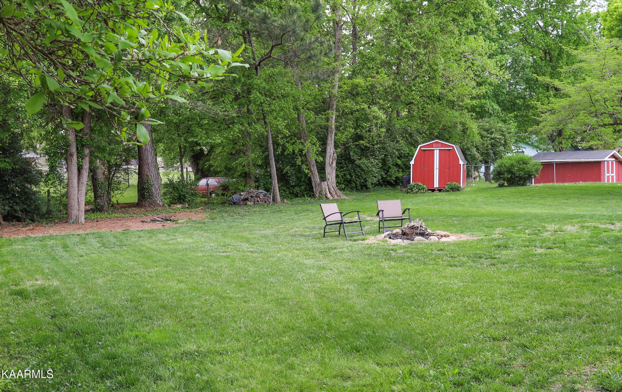 4105 Sullivan Road Knoxville, TN 37921 - Photo 5 of 45 a backyard of a house with table and chairs