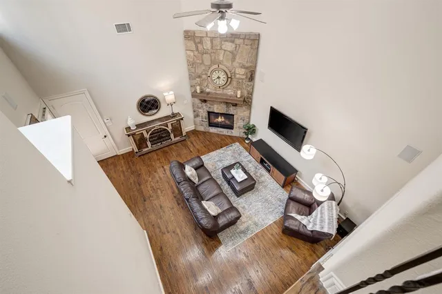 a living room with furniture and a fireplace