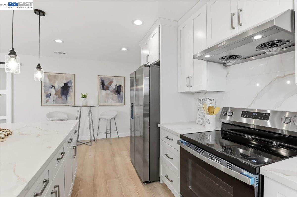 4519 Edwards Lane Castro Valley, CA 94546 - Photo 11 of 46 a kitchen with stainless steel appliances granite countertop a stove and a refrigerator