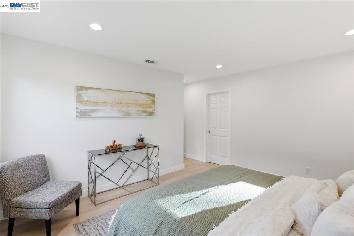 4519 Edwards Lane Castro Valley, CA 94546 - Photo 18 of 46 a bedroom with a bed and chair