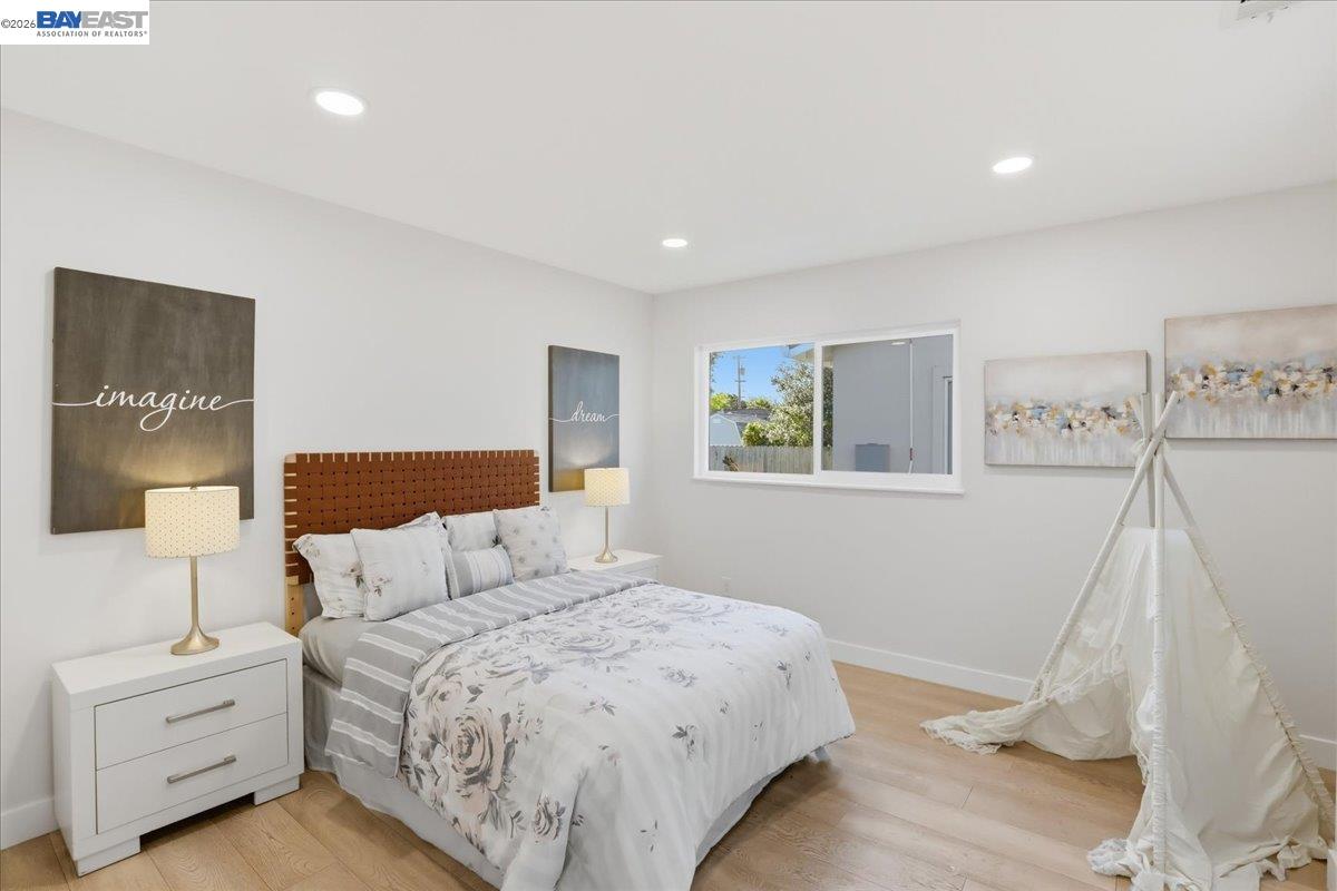 4519 Edwards Lane Castro Valley, CA 94546 - Photo 20 of 46 a bedroom with a bed and a night stand
