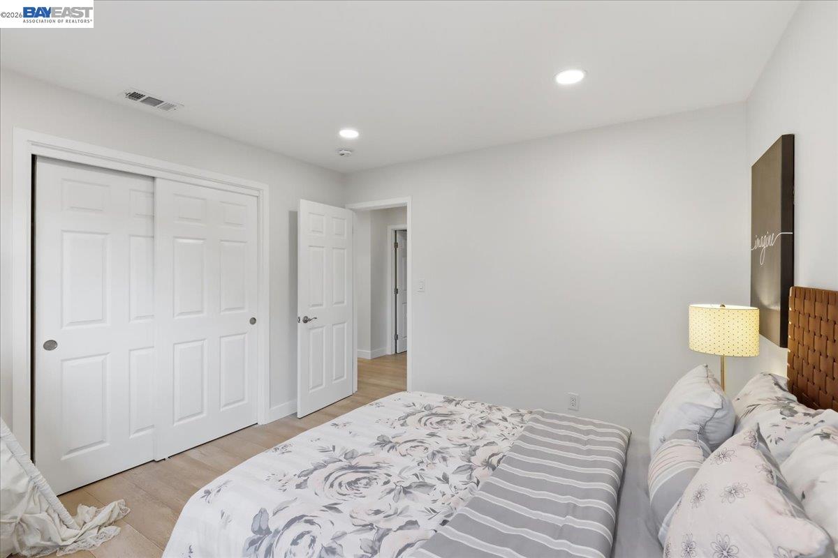 4519 Edwards Lane Castro Valley, CA 94546 - Photo 21 of 46 a bedroom with a bed and a window