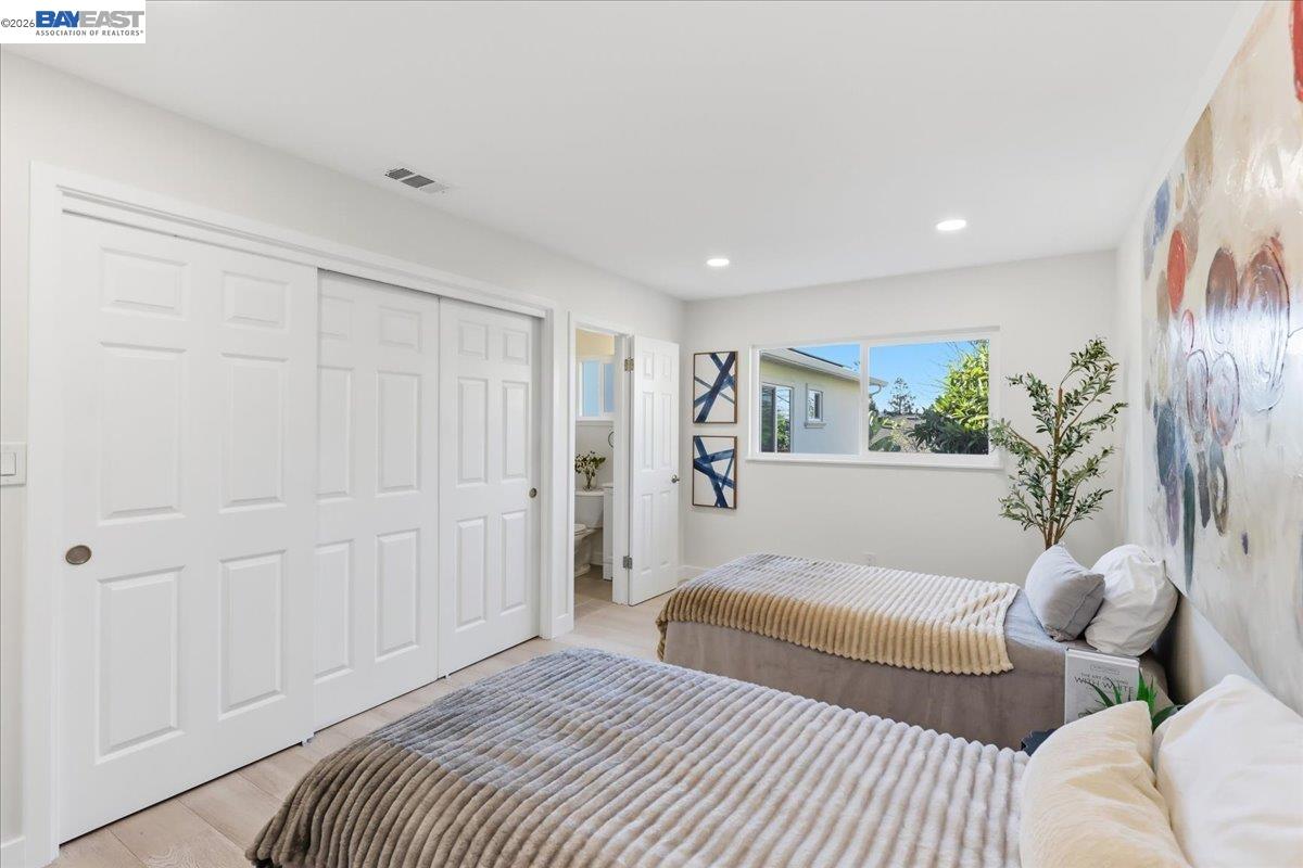4519 Edwards Lane Castro Valley, CA 94546 - Photo 24 of 46 a bedroom with a large bed couch and a window
