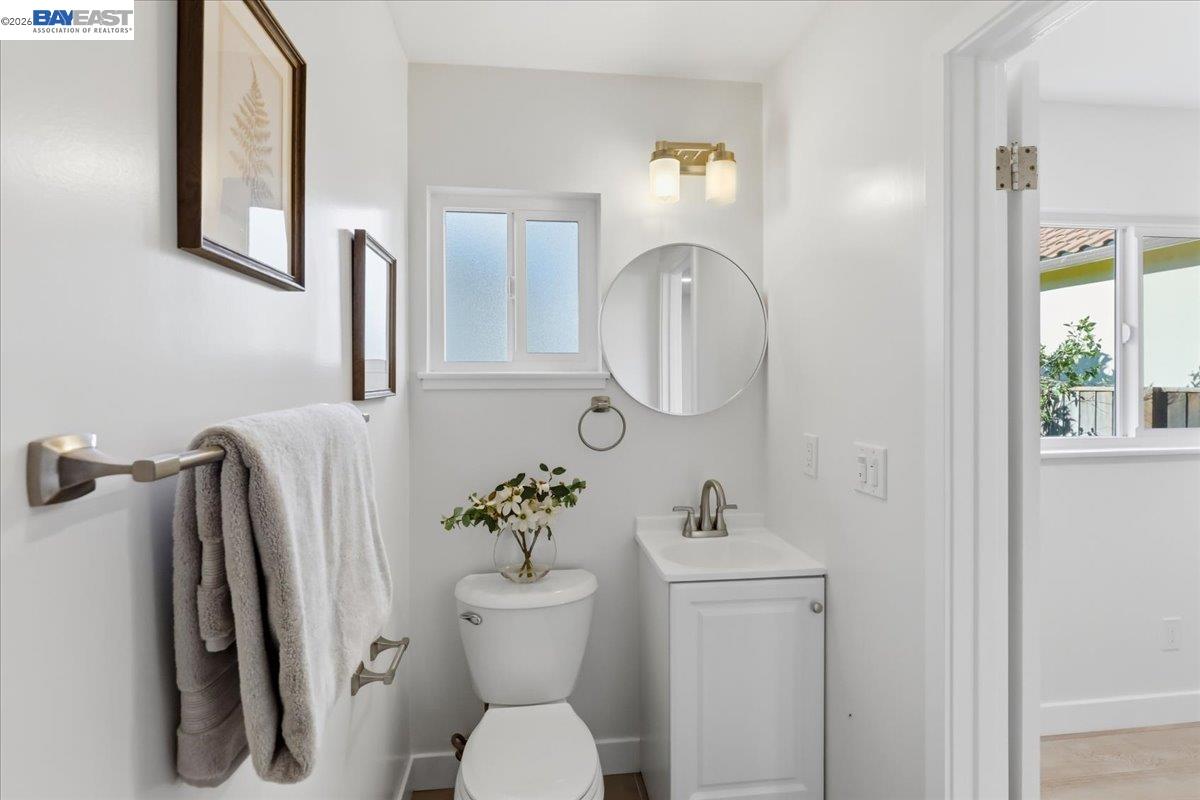 4519 Edwards Lane Castro Valley, CA 94546 - Photo 25 of 46 a bathroom with a toilet sink and mirror