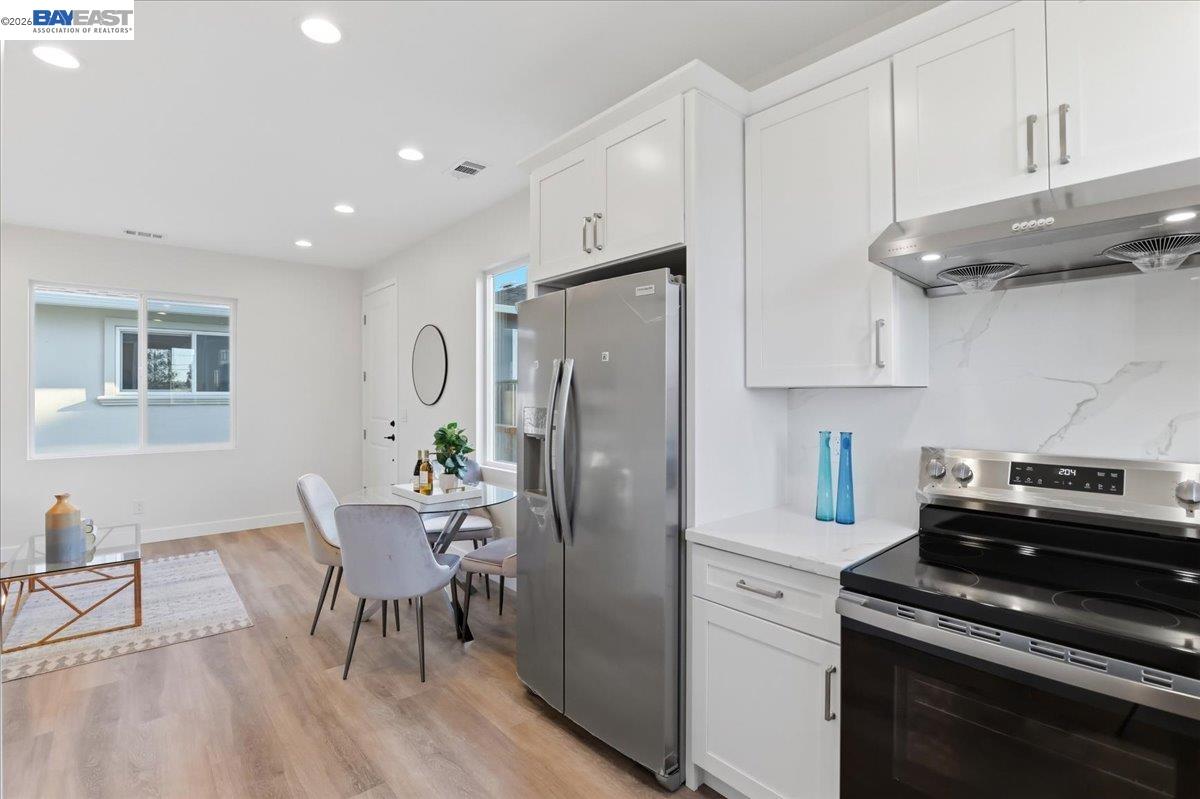 4519 Edwards Lane Castro Valley, CA 94546 - Photo 34 of 46 a kitchen with stainless steel appliances granite countertop a table chairs stove and cabinets