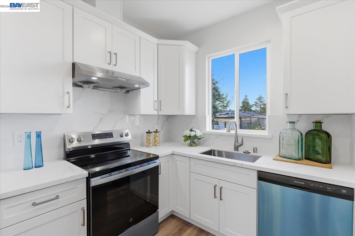 4519 Edwards Lane Castro Valley, CA 94546 - Photo 35 of 46 a kitchen with stainless steel appliances white cabinets and a sink