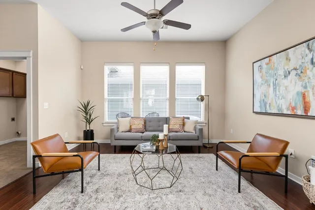 a living room with furniture and a large window