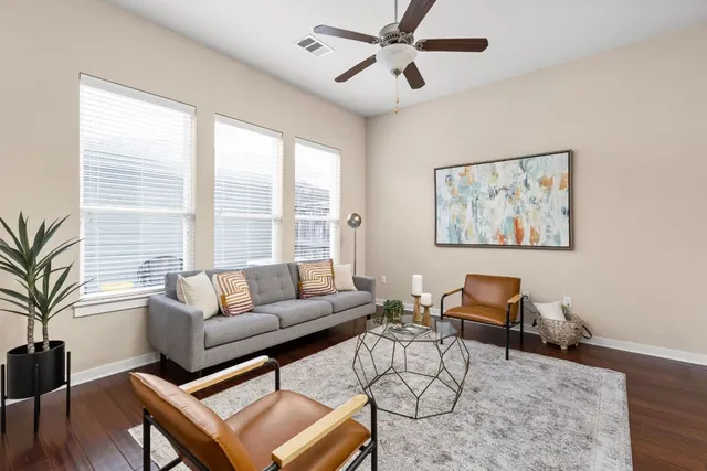 a living room with furniture and a large window
