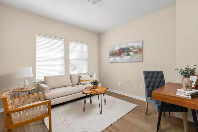 a living room with furniture and a window