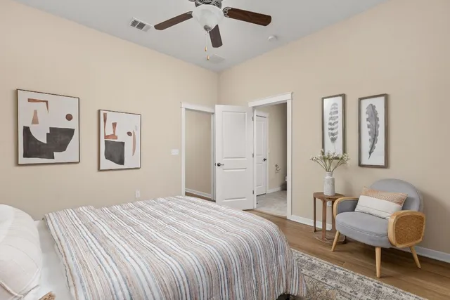 a bedroom with a bed and a chair