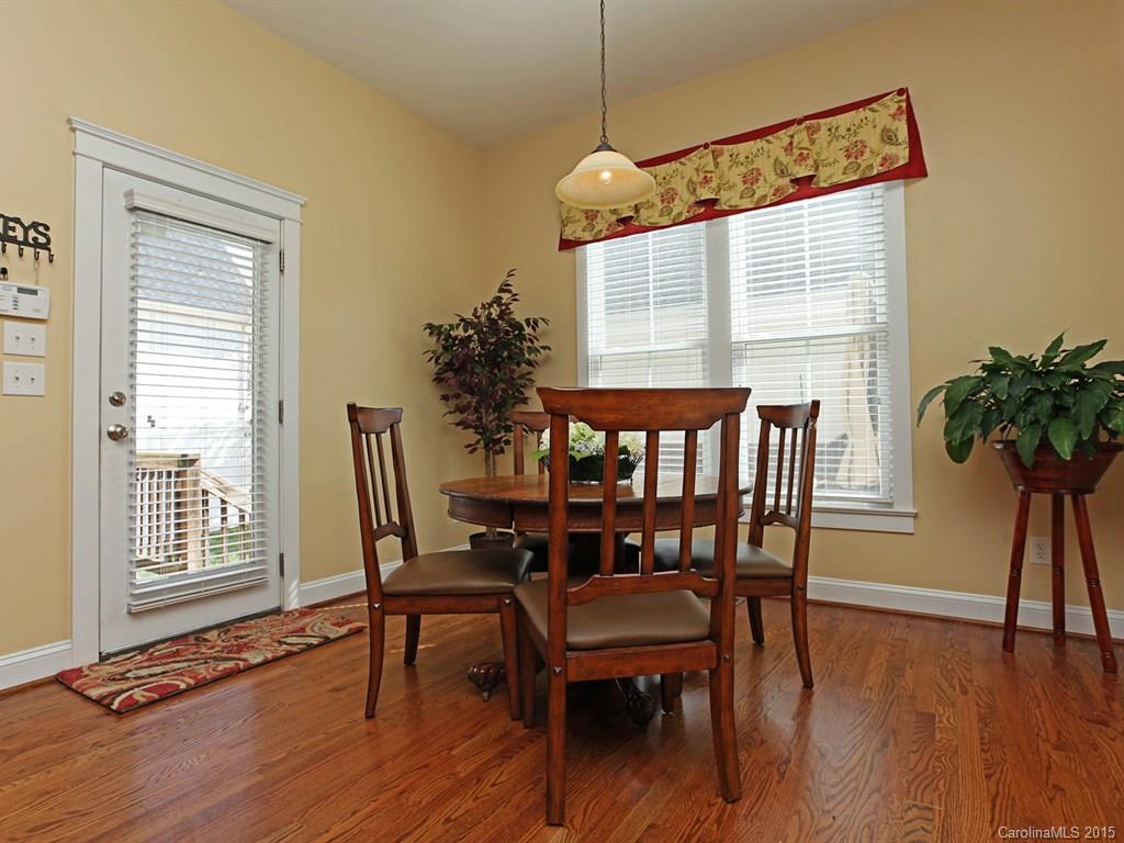 742 Revival Row Fort Mill, SC 29708 - Photo 14 of 24 a view of a dining room with furniture window and wooden floor