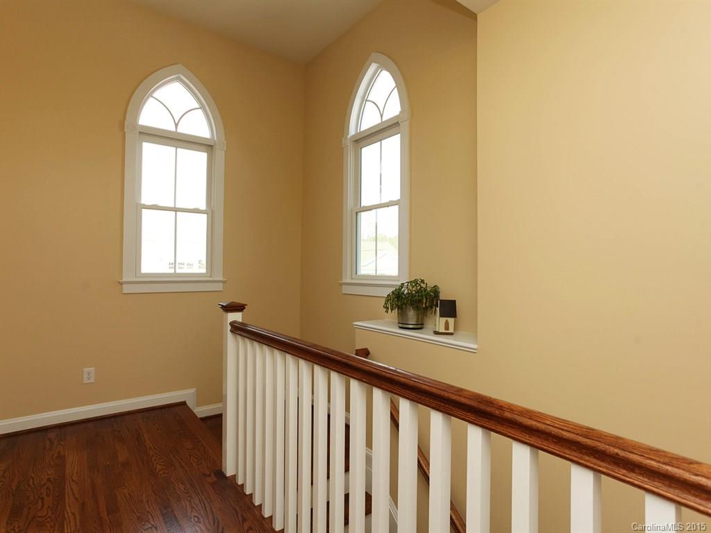 742 Revival Row Fort Mill, SC 29708 - Photo 15 of 24 a view of empty room with wooden floor and fan
