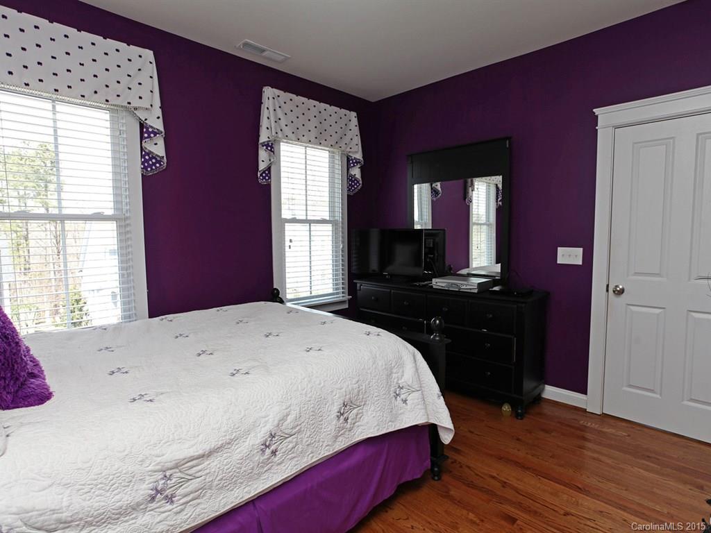 742 Revival Row Fort Mill, SC 29708 - Photo 21 of 24 a spacious bedroom with a bed and a dresser