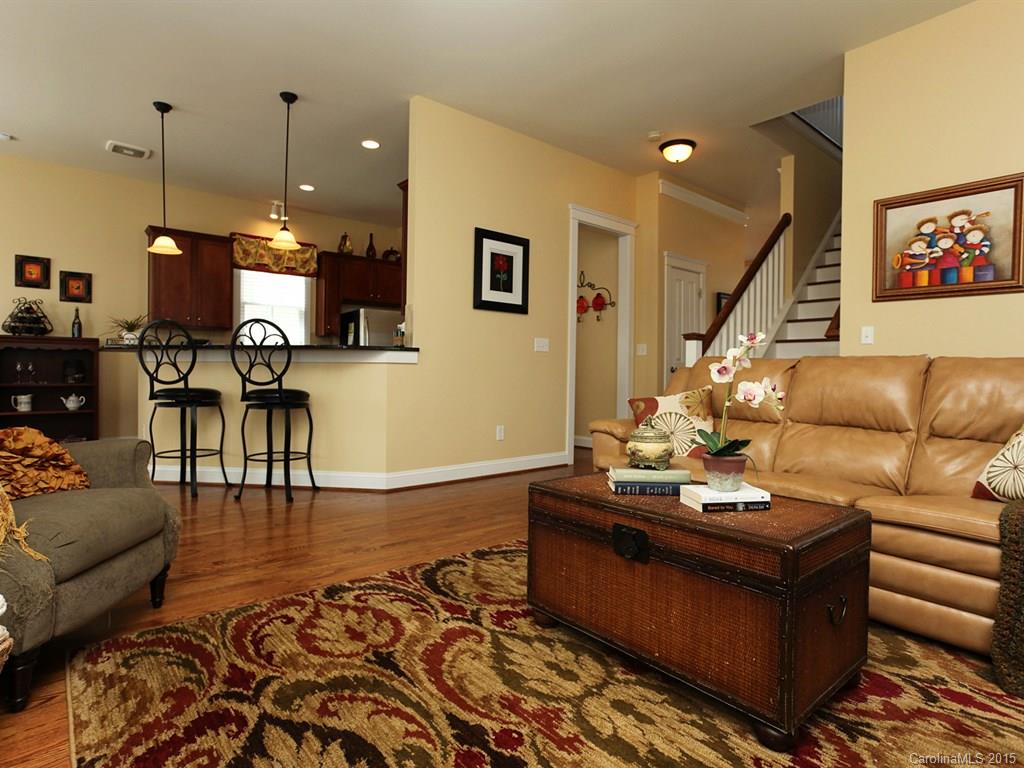 742 Revival Row Fort Mill, SC 29708 - Photo 7 of 24 a living room with furniture and wooden floor