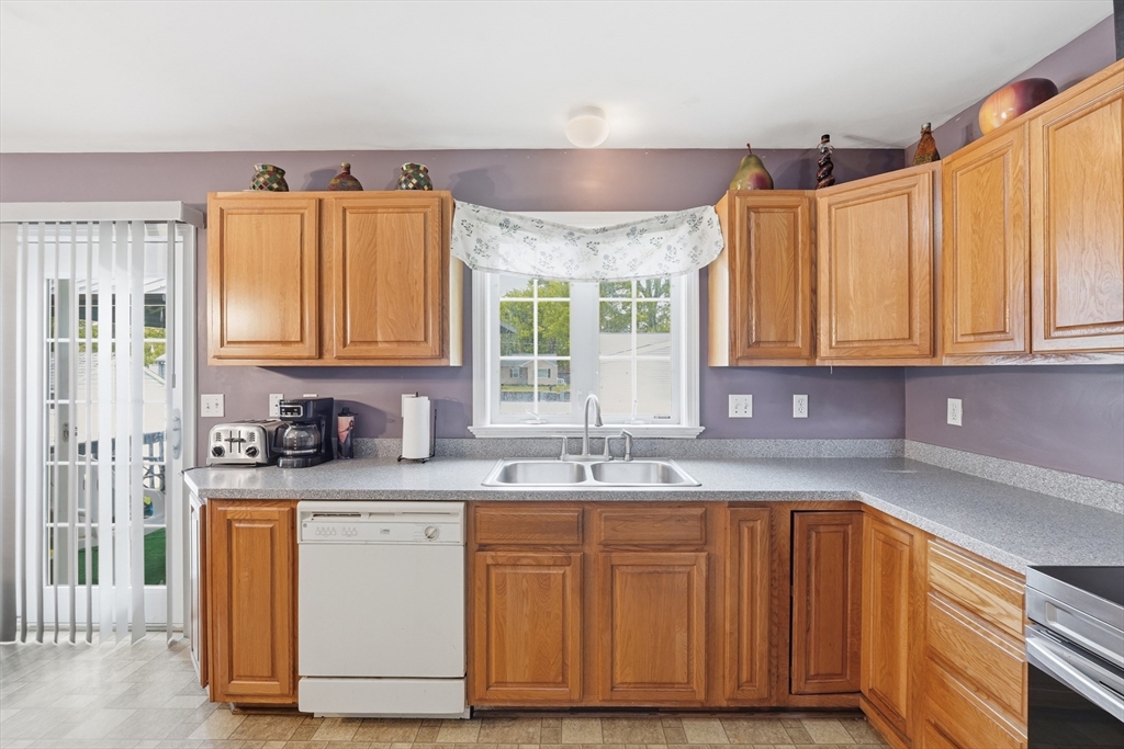 19 Annies Way Springfield, MA 01119 - Photo 12 of 40 a kitchen with stainless steel appliances granite countertop a sink window and cabinets