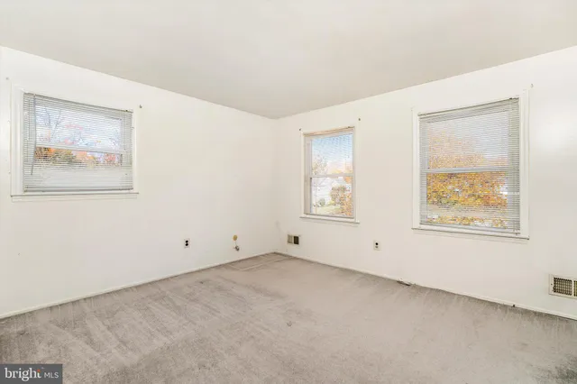 a view of an empty room with stairs