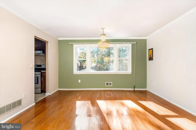 a view of room with window and entryway