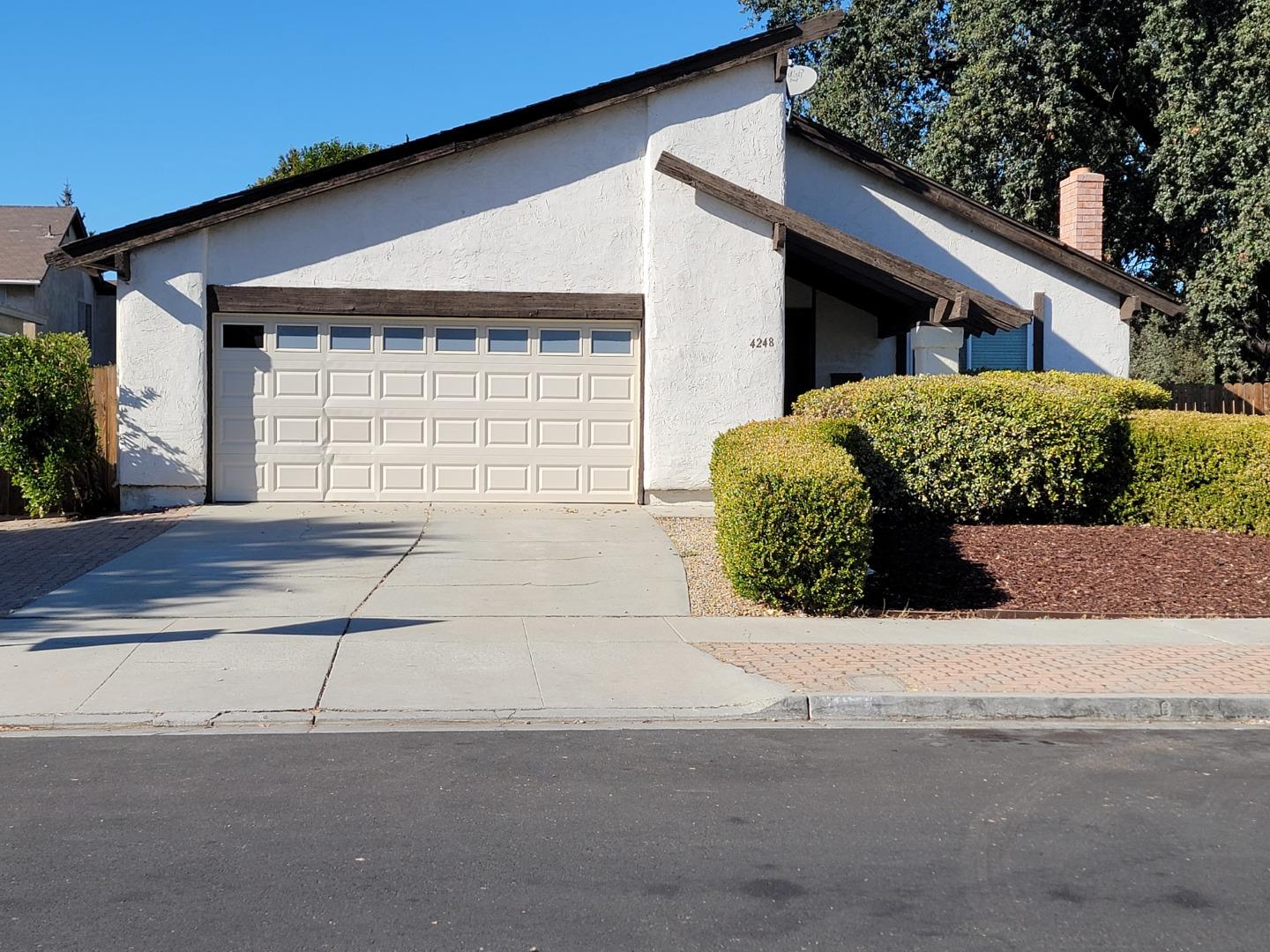 a front view of a house with a garage