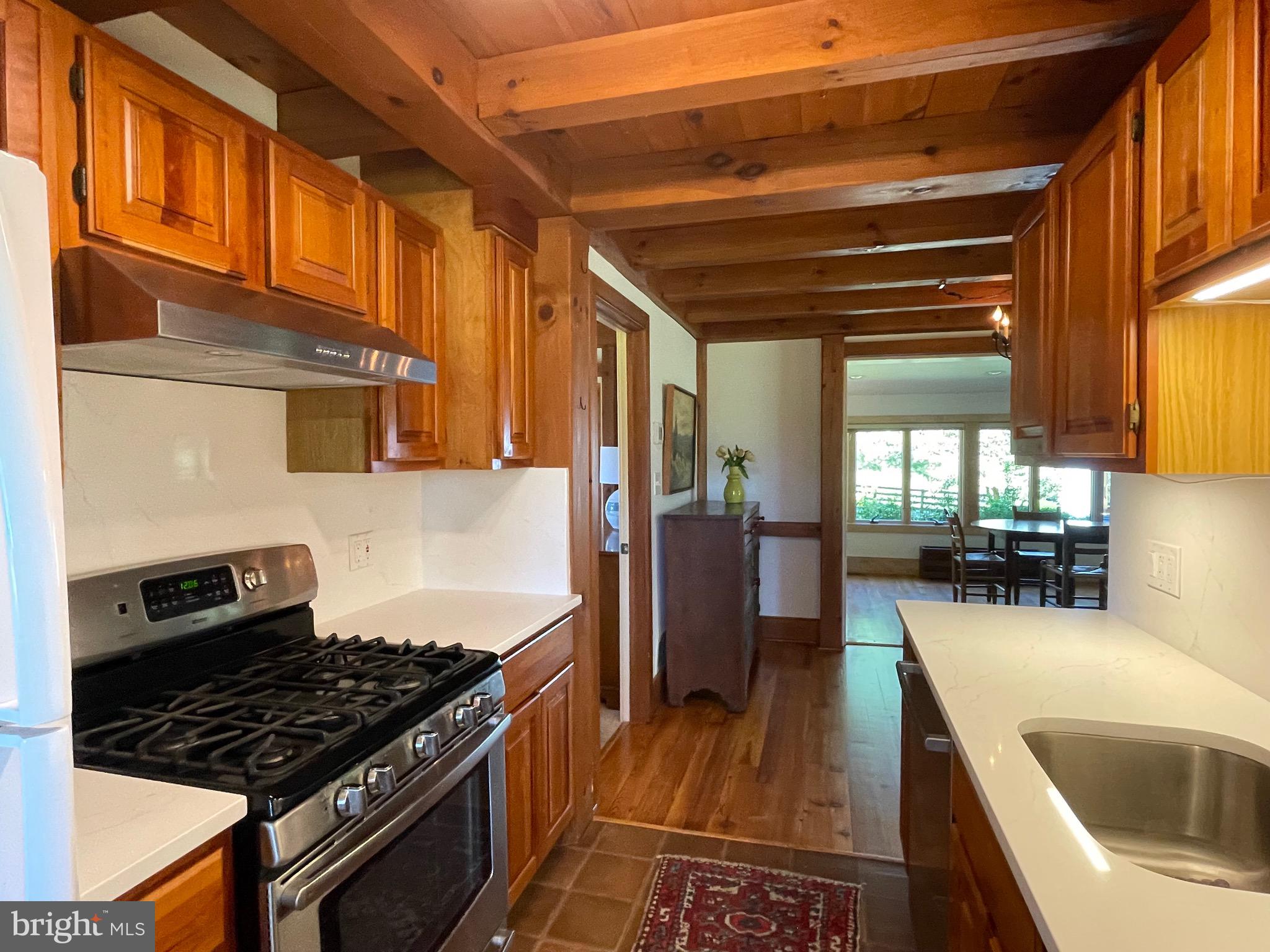 521 Dearing Road Huntly, VA 22640 - Photo 17 of 40 a kitchen with granite countertop a stove and a sink