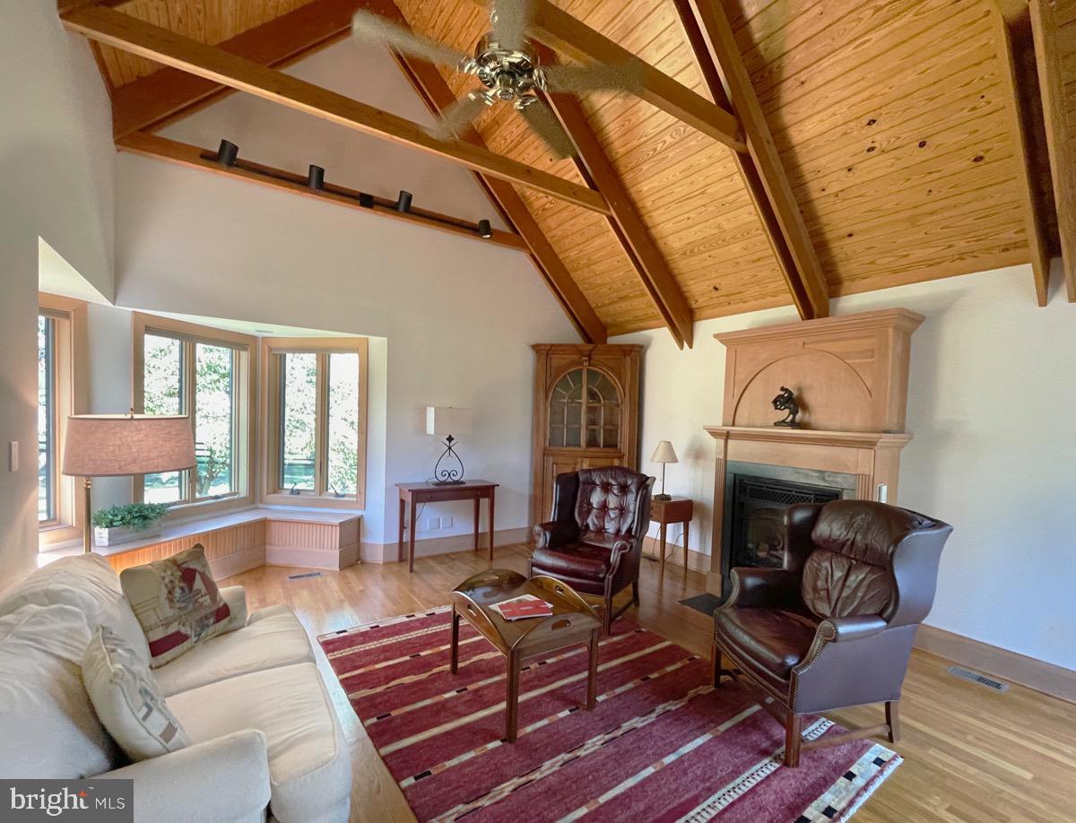 521 Dearing Road Huntly, VA 22640 - Photo 19 of 40 a living room with furniture a fireplace and a large window
