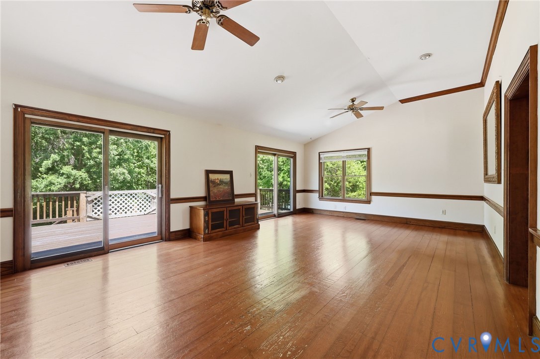 3355 Duke Road Powhatan, VA 23139 - Photo 23 of 67 a view of a livingroom with hardwood floor and a ceiling fan