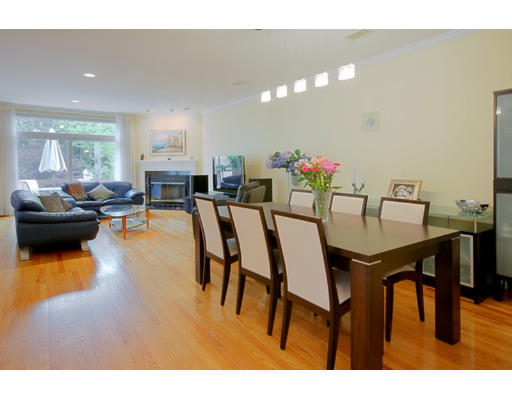 a view of a dining room with furniture and a potted plant