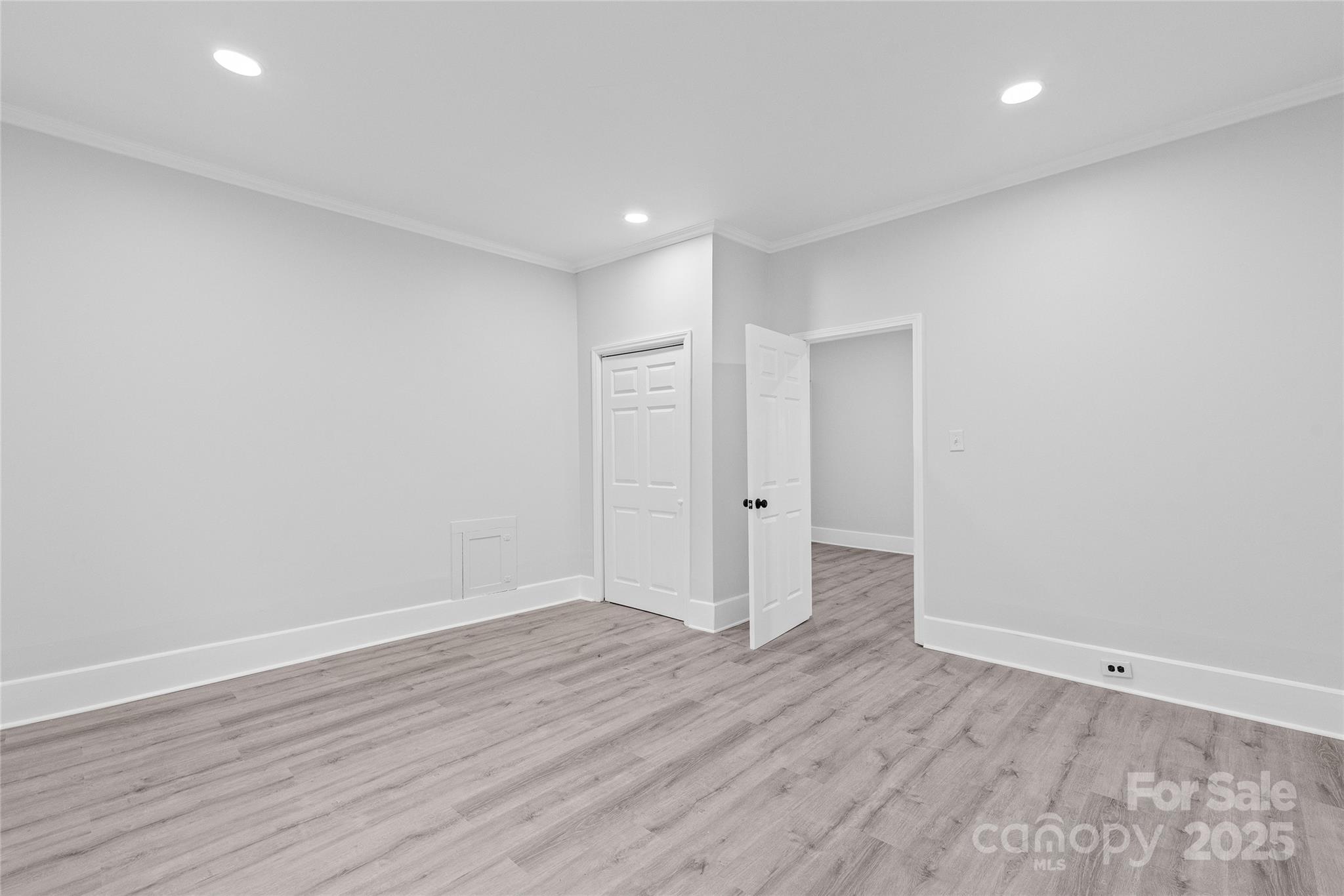 63 3rd Street Northwest Concord, NC 28027 - Photo 19 of 28 a view of an empty room with wooden floor