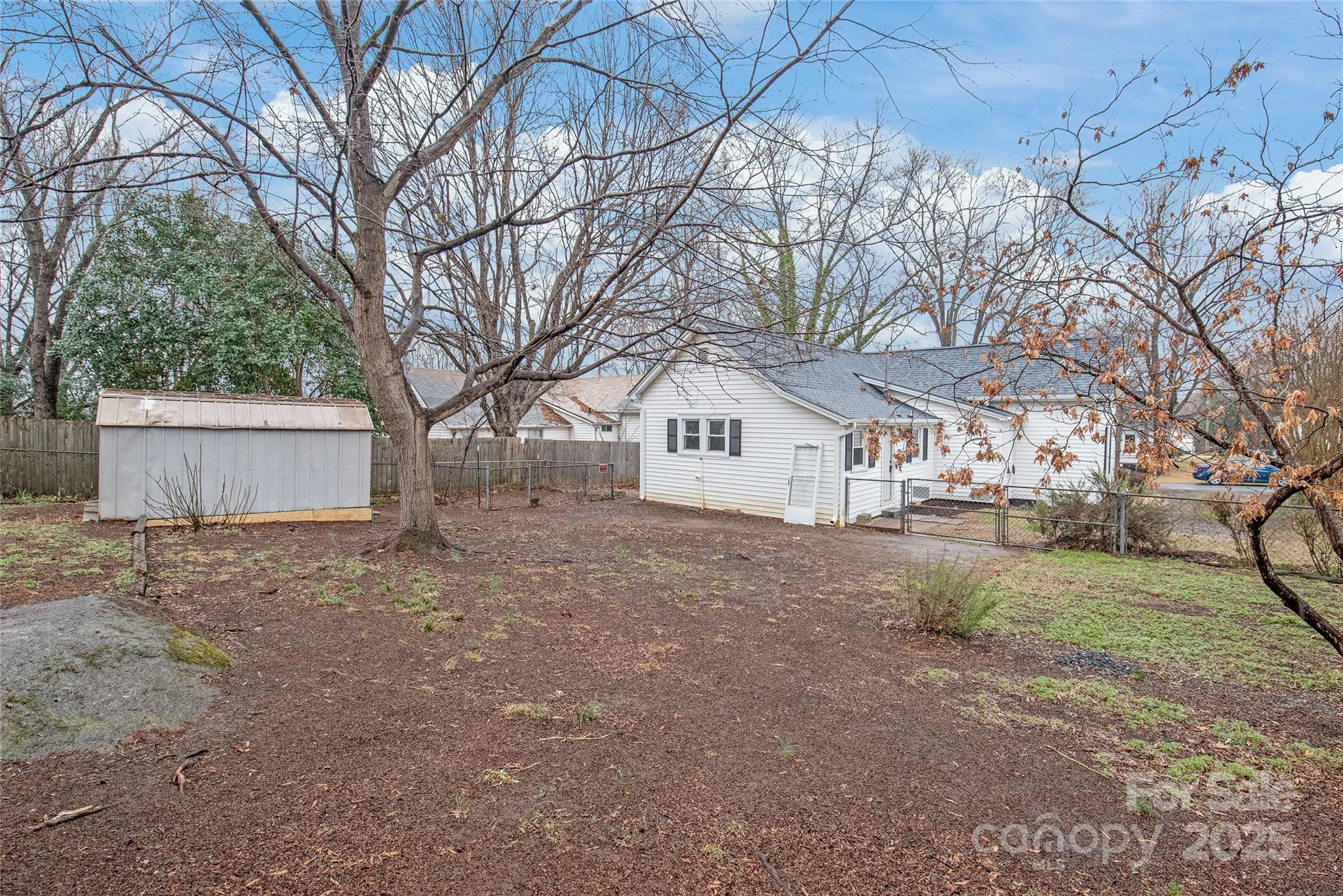 63 3rd Street Northwest Concord, NC 28027 - Photo 23 of 28 a view of a house with a yard and garage